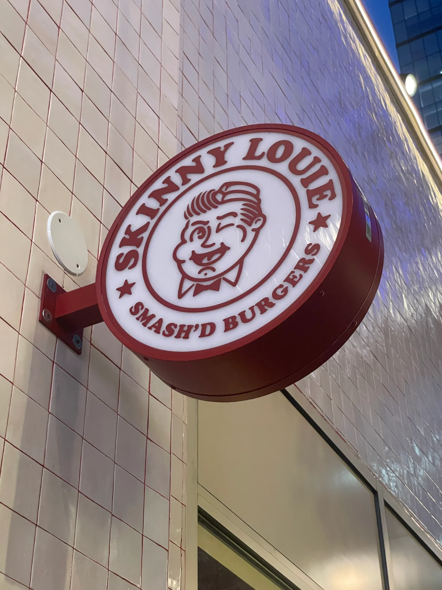 2026-09-08_193316_New-York_Skinny-Louie-Round-Storefront-Sign_IMG-6354.jpg